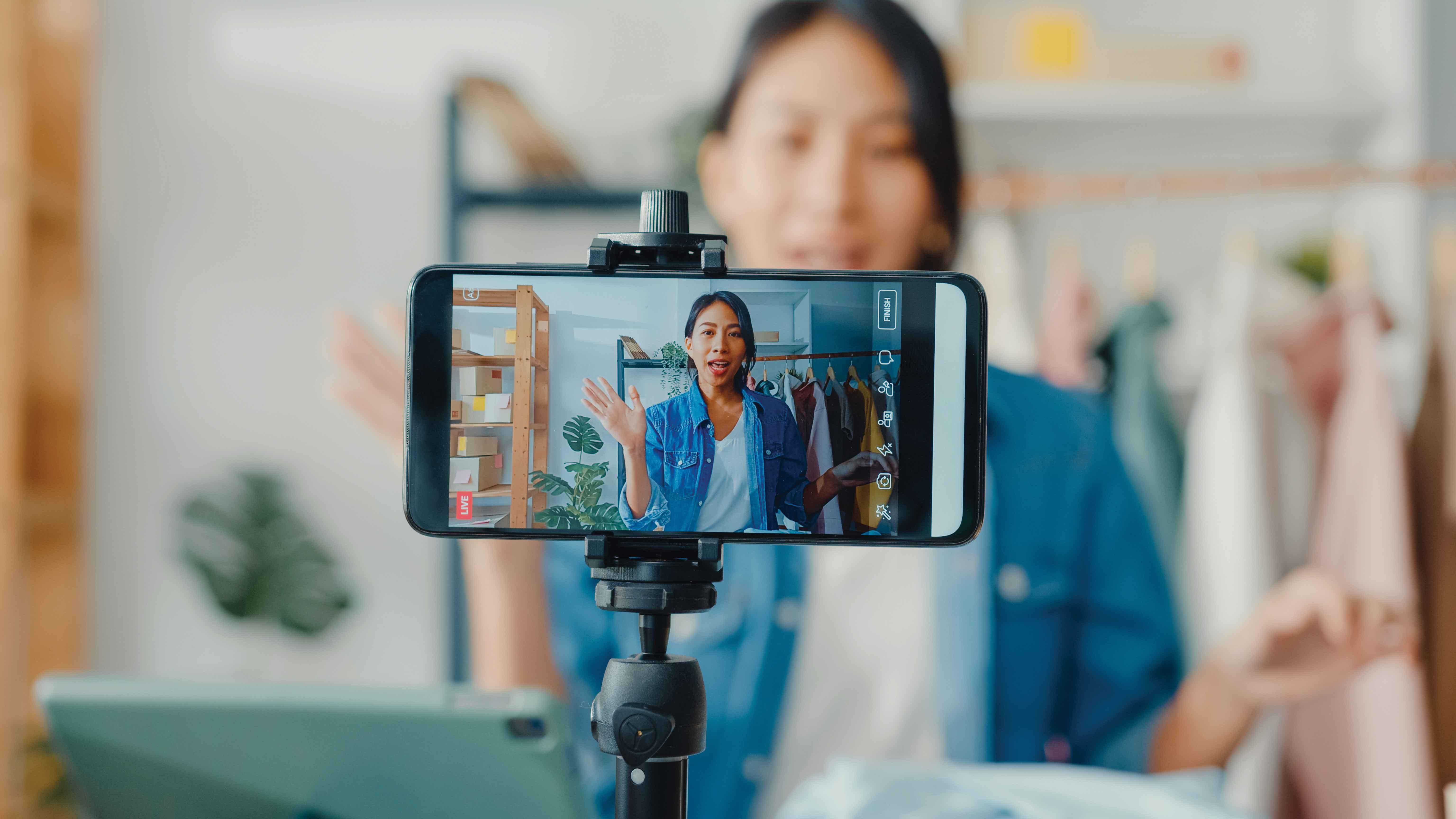 Picture that shows a woman recording herself from an iPhone