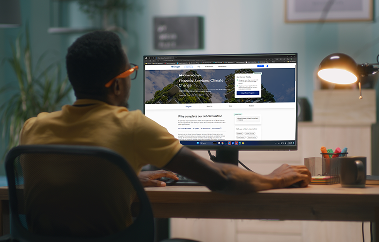 Photography of a man in front of a computer showing the virtual job simulation tool